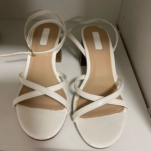 Strappy white heeled sandals